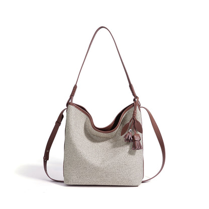 Slouchy Canvas Bucket Clutch Bag with Tassel Charm