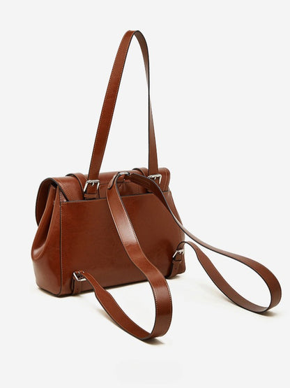 The Oil-Waxed Genuine Leather Convertible Flap Backpack Shoulder Bag