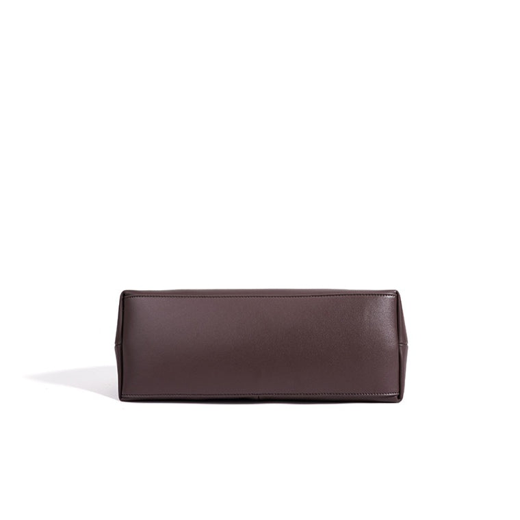 Minimalist Supple Genuine Leather Curved Clutch Bag with Playful Charm