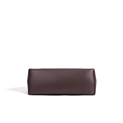 Minimalist Supple Genuine Leather Curved Clutch Bag with Playful Charm