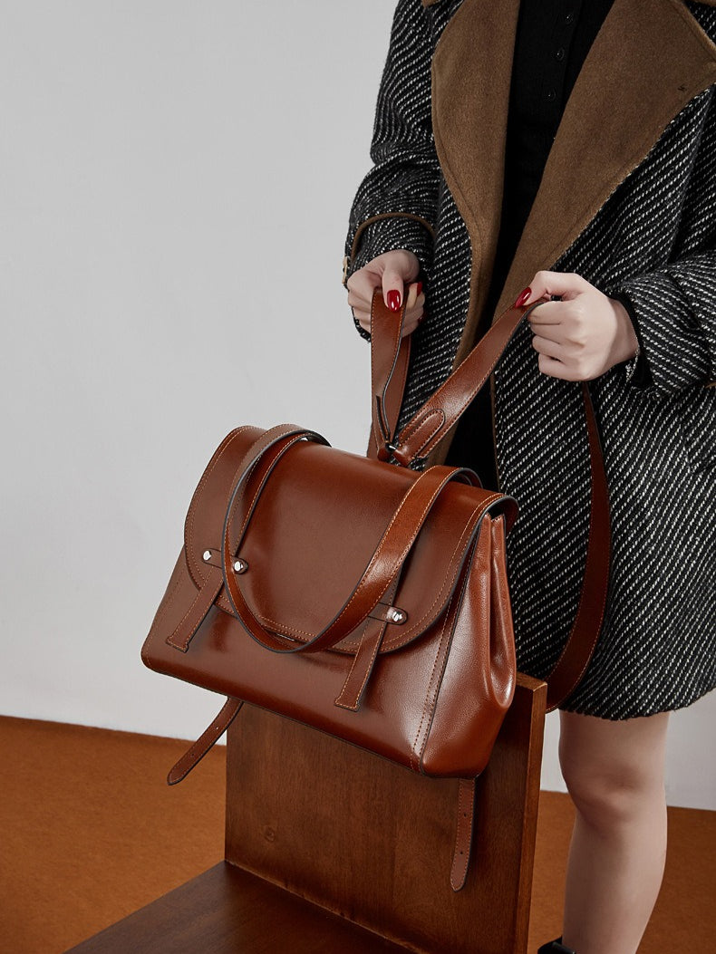 The Oil-Waxed Genuine Leather Convertible Flap Backpack Shoulder Bag