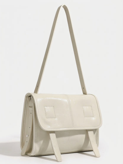 Borsa a spalla e tracolla minimalista in vera pelle testurizzata con patta