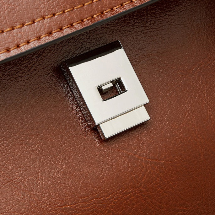The Oil-Waxed Genuine Leather Convertible Flap Backpack Shoulder Bag