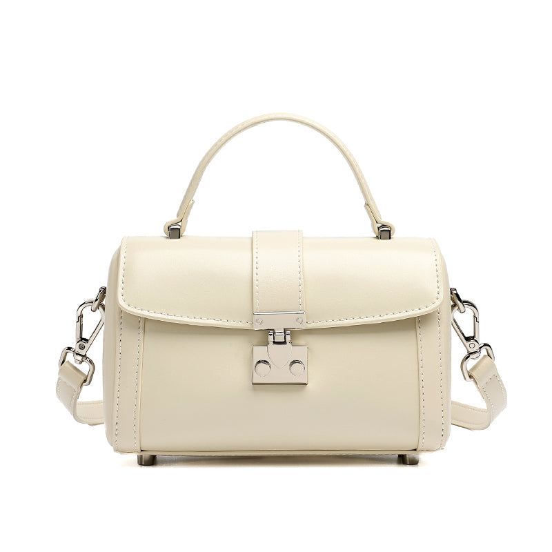 Bolso de mano tipo clutch cilíndrico de cuero genuino con estilo chic  
