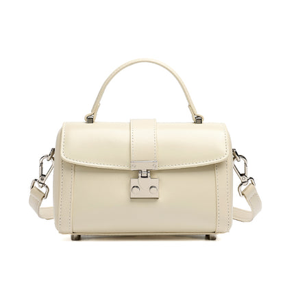 Bolso de mano tipo clutch cilíndrico de cuero genuino con estilo chic  