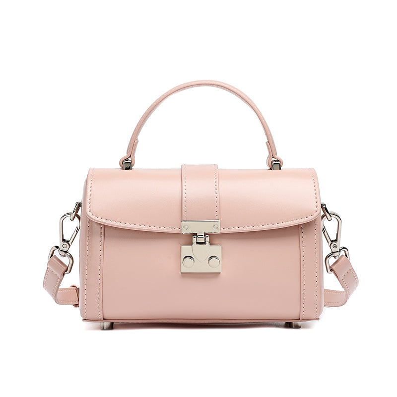 Bolso de mano tipo clutch cilíndrico de cuero genuino con estilo chic  