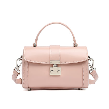 Bolso de mano tipo clutch cilíndrico de cuero genuino con estilo chic  