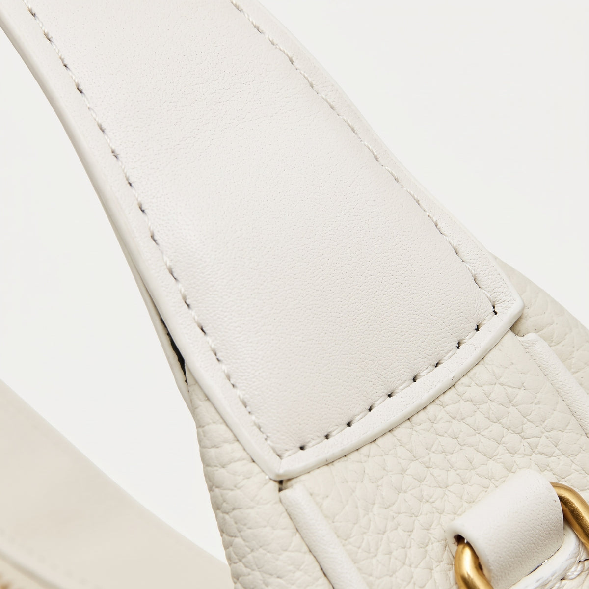 Borsa minimalista a spalla e tracolla a mezzaluna in vera pelle martellata