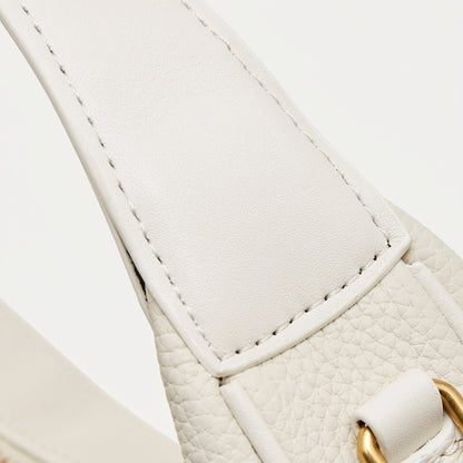 Borsa minimalista a spalla e tracolla a mezzaluna in vera pelle martellata