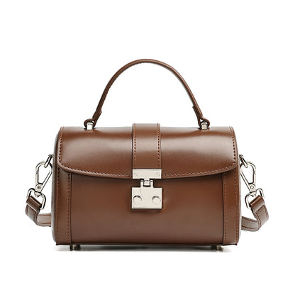 Bolso de mano tipo clutch cilíndrico de cuero genuino con estilo chic  