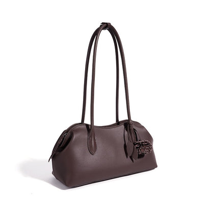 Minimalist Supple Genuine Leather Curved Clutch Bag with Playful Charm