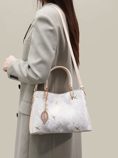 Sophisticated Oriental Jacquard Vegan Eco‑Leather Clutch Bag with Leaf Charm
