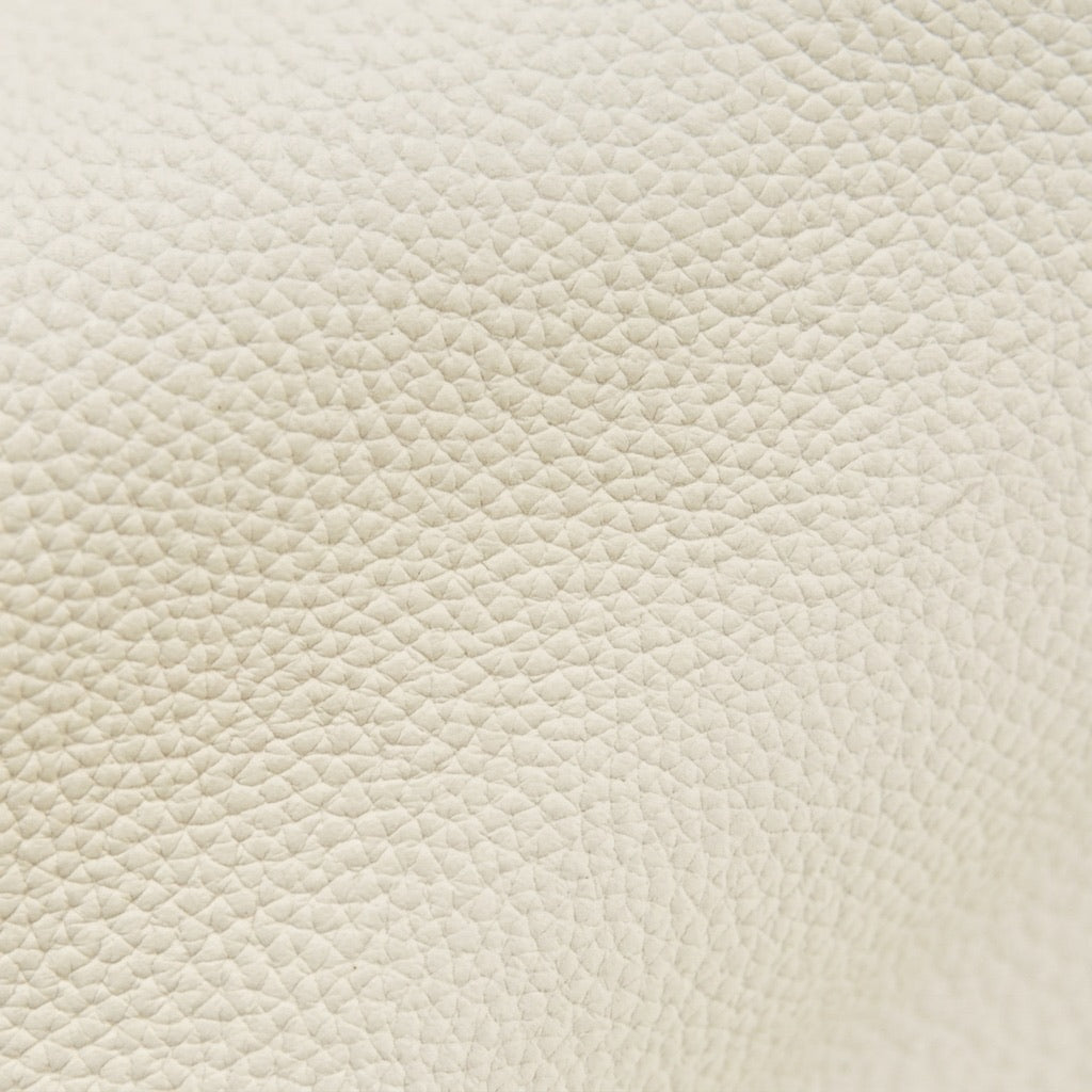 Borsa minimalista a spalla e tracolla a mezzaluna in vera pelle martellata