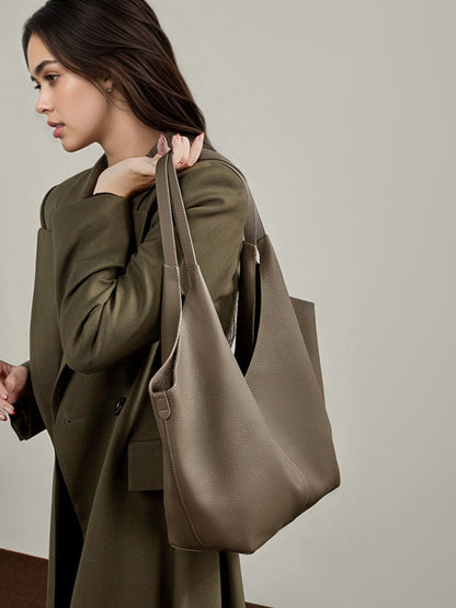 حقيبة إيثيرال في-كات جلد طبيعي | حقيبة هوبو بسيطة من جلد الحصى