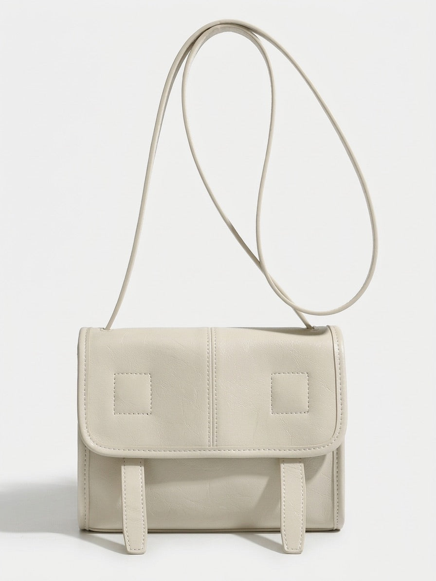 Borsa a spalla e tracolla minimalista in vera pelle testurizzata con patta