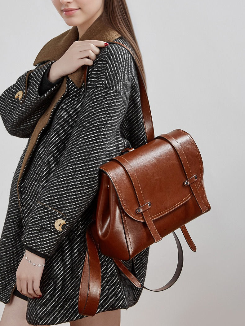 The Oil-Waxed Genuine Leather Convertible Flap Backpack Shoulder Bag