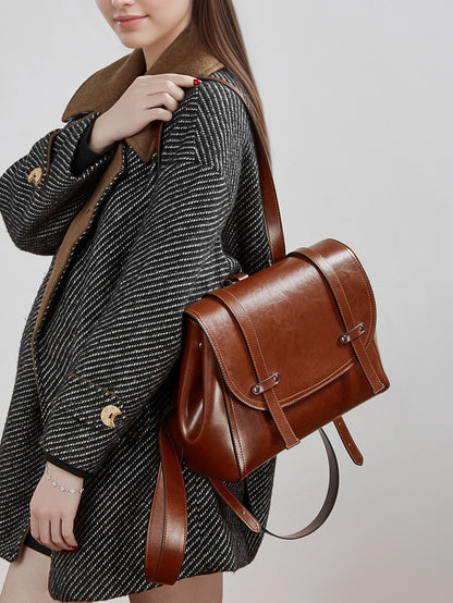 The Oil-Waxed Genuine Leather Convertible Flap Backpack Shoulder Bag