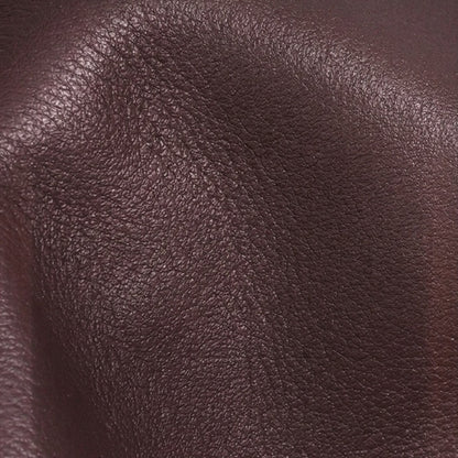 Minimalist Supple Genuine Leather Curved Clutch Bag with Playful Charm