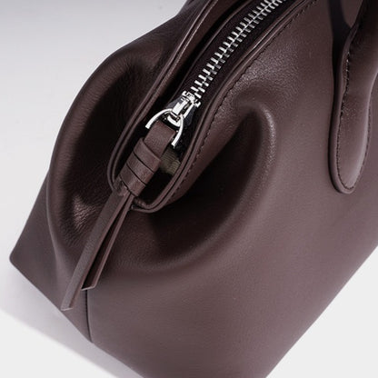 Minimalist Supple Genuine Leather Curved Clutch Bag with Playful Charm