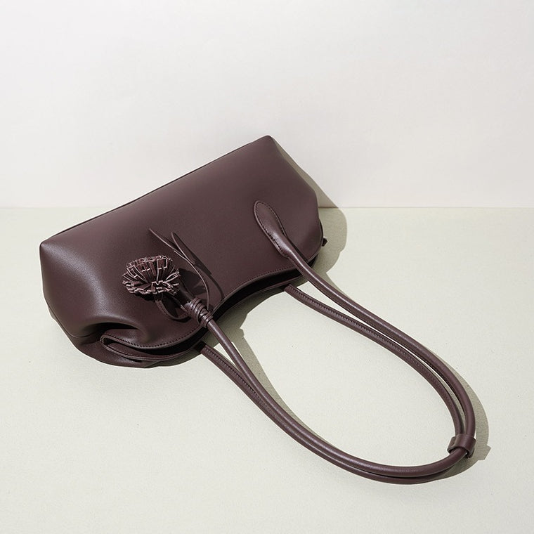 Minimalist Supple Genuine Leather Curved Clutch Bag with Playful Charm