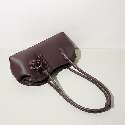 Minimalist Supple Genuine Leather Curved Clutch Bag with Playful Charm