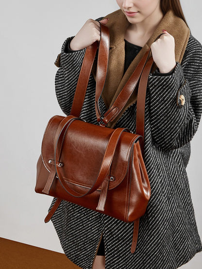 The Oil-Waxed Genuine Leather Convertible Flap Backpack Shoulder Bag