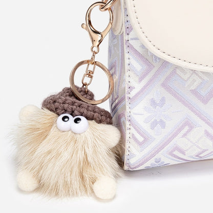 Borsa clutch vintage in ecopelle vegana con ricami orientali e charm giocoso