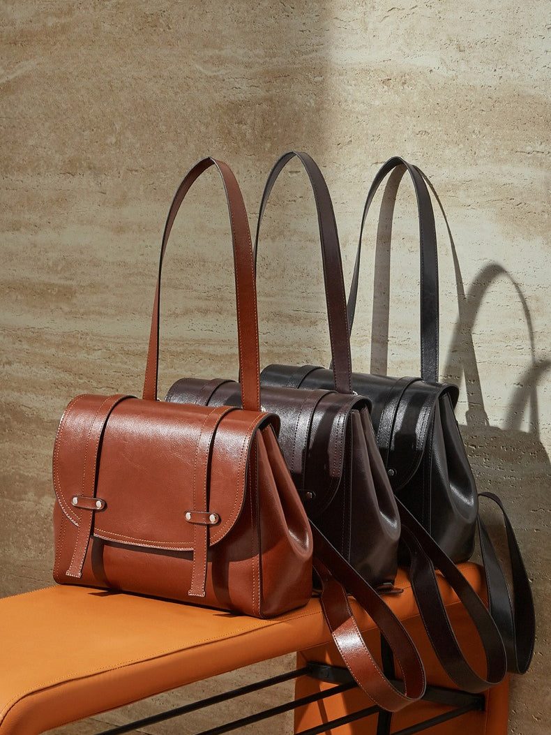 The Oil-Waxed Genuine Leather Convertible Flap Backpack Shoulder Bag