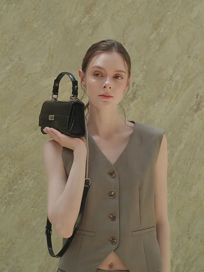 Bolso clutch sobre vintage de cuero genuino con acabado brillante tipo cocodrilo