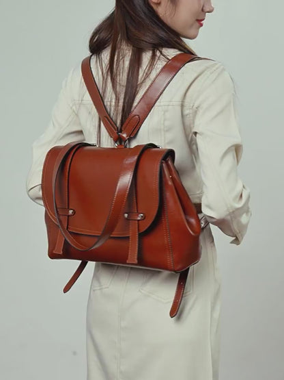 The Oil-Waxed Genuine Leather Convertible Flap Backpack Shoulder Bag