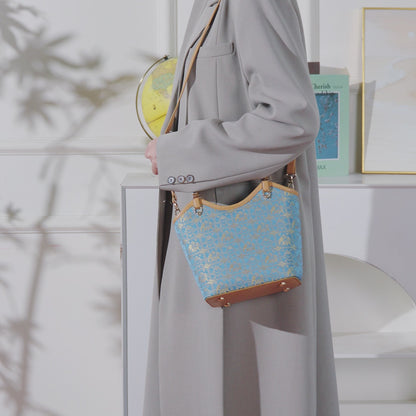 Refined Golden Elephant Motif Vegan Eco-Leather Bucket Clutch Bag
